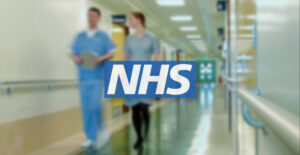 Image of NHS staff in a hospital corridor and an NHS logo